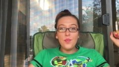 Racy Nerdy Brunette Chick Smoking Outside In Glasses With Hair Up Tmnt Shirt
